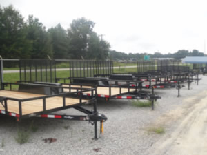 Row of utility trailers for sale at Dixon Wrecking